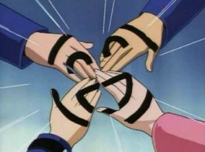 four markered hands together form a smiley face