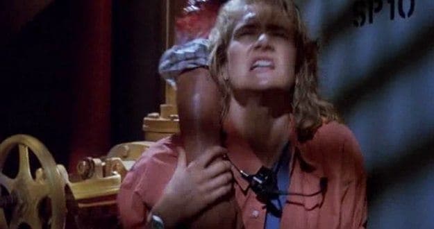 Ellie clutches a severed arm.