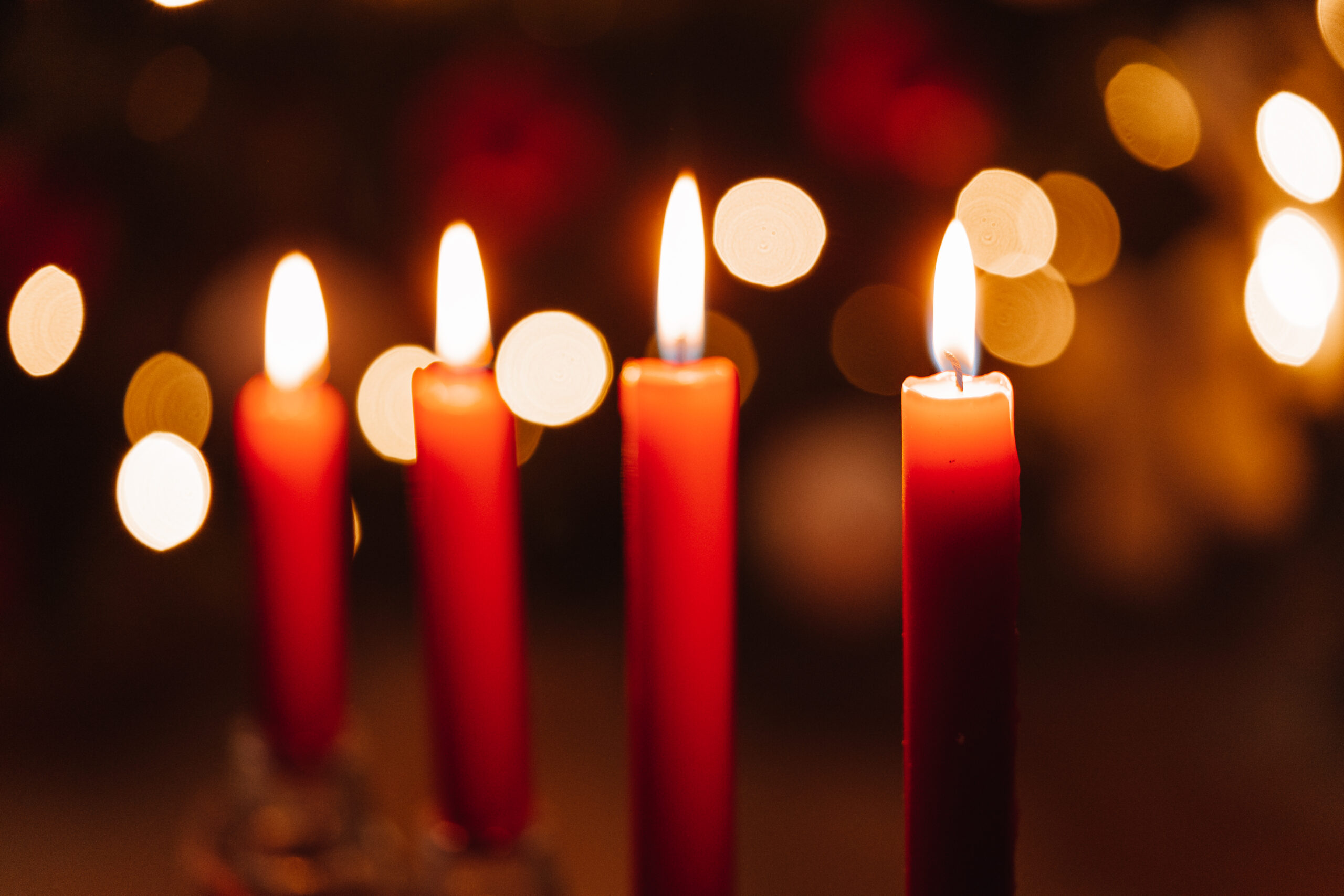 four red candles in soft focus, photo by PicJumbo